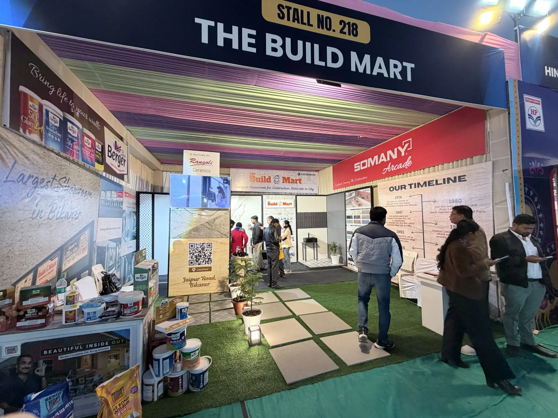 Illuminated The Build Mart stall during an evening session of the trade fair