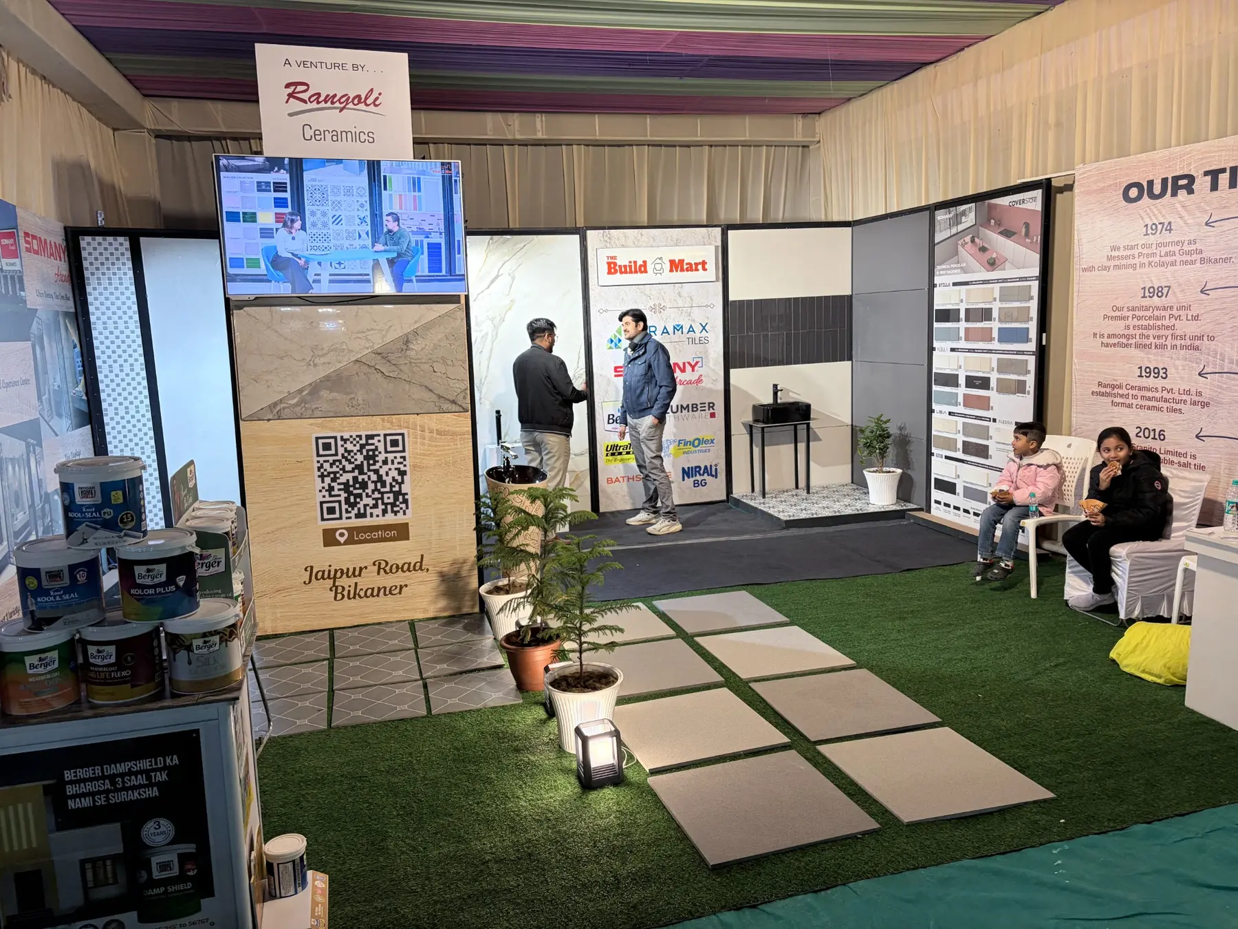 Walk-through tile and building material display inside The Build Mart exhibition stall