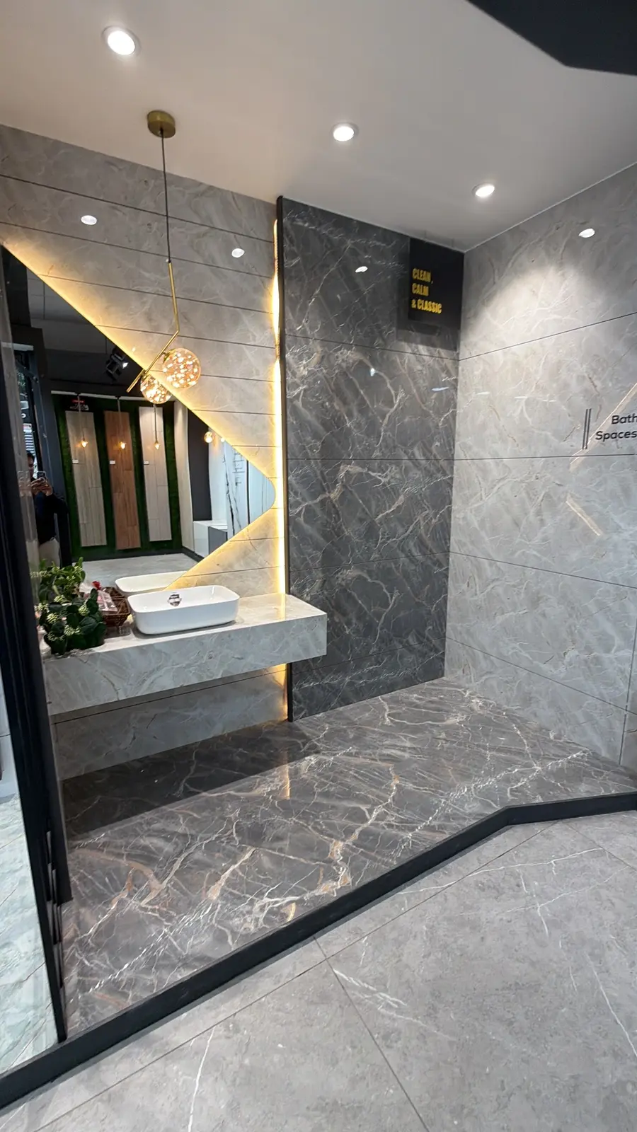 Grey marble-look Somany wall and floor tiles in an illuminated Arcade display