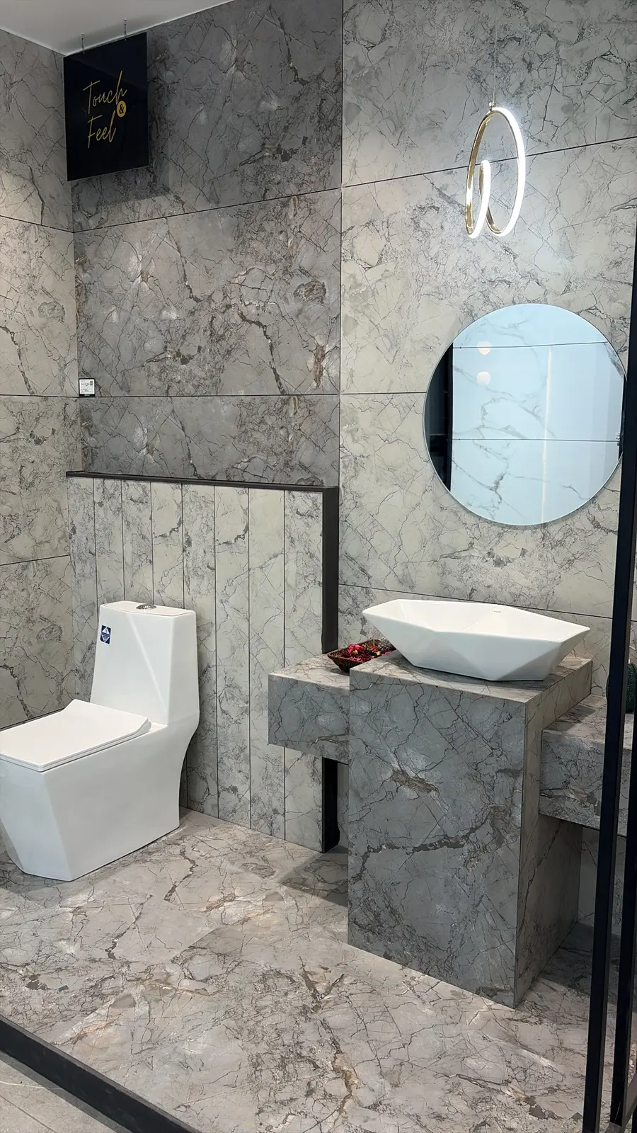 Stone-look Somany tiles with sanitaryware in The Build Mart Somany Arcade display