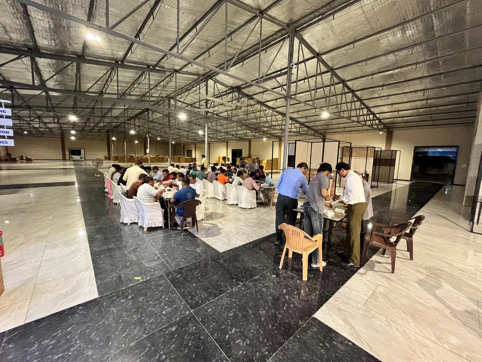 Plumbers and hosts sharing dinner after the meet at The Build Mart premises