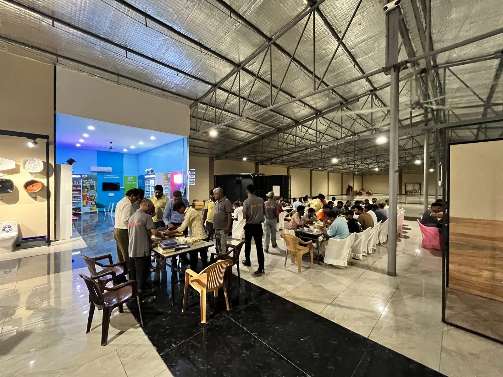 Community dinner hosted inside The Build Mart showroom after the plumber meet