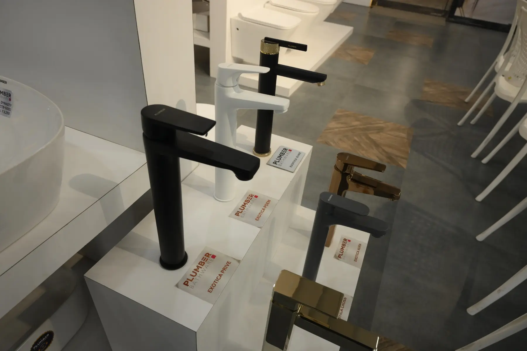 Black, white and brushed-finish Plumber Bathware basin faucets displayed at The Build Mart Bikaner