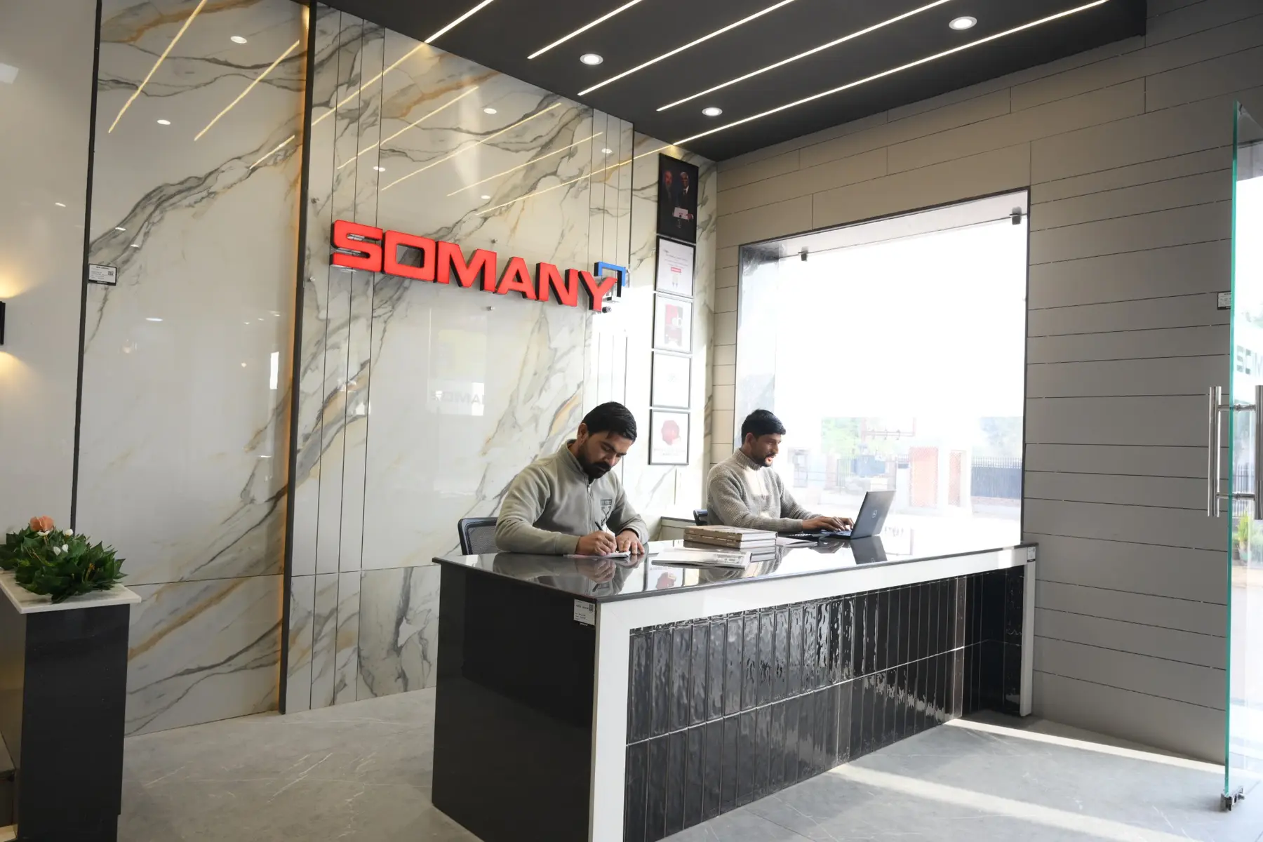 Full-height large-format tile slabs displayed inside the Somany Arcade section at The Build Mart Bikaner