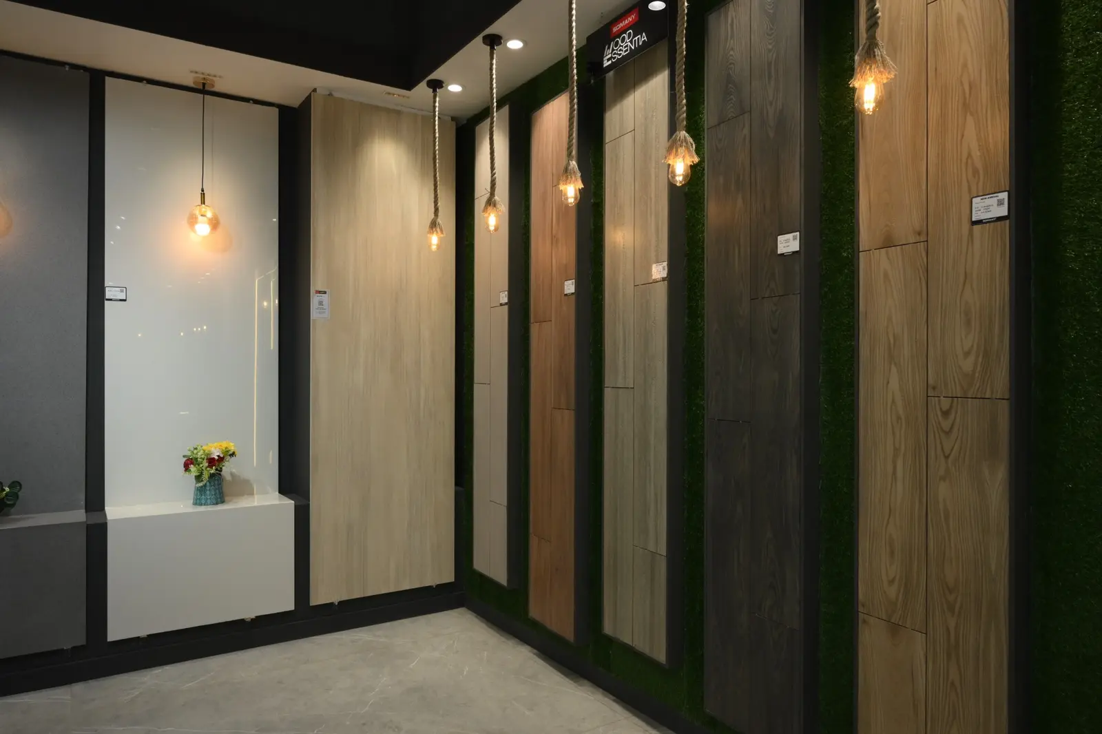 Wood-look and neutral Somany tile panels displayed with warm lighting
